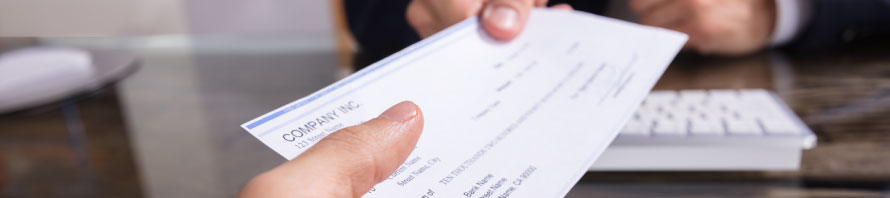 Handing someone a paycheck Handing someone a paycheck